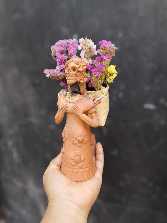 Rosita (basket in the back, Oaxacan skull)